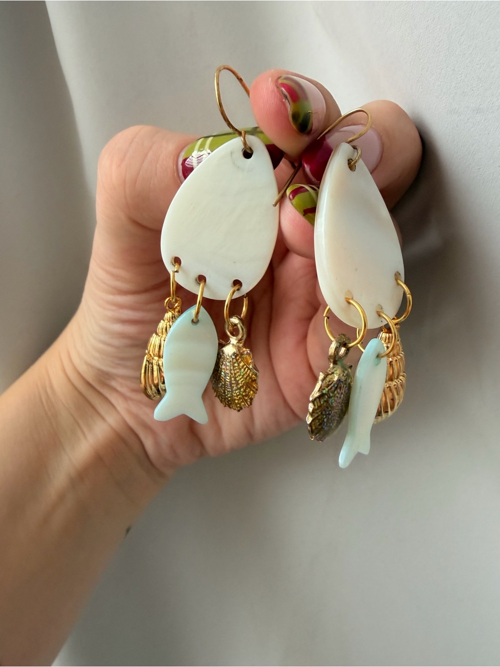 Gold and White Seashell Drop Earrings with Fish Charms